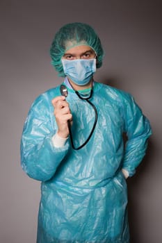 young man doctor, on a dark background