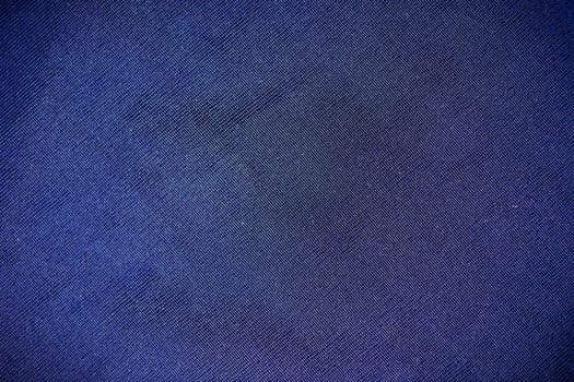 Part synthetic clothes blue purple. macro photo