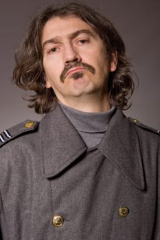 young man dressed as russian military, studio picture