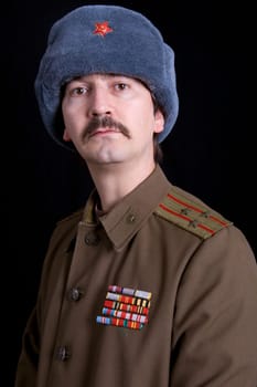 young man dressed as russian military, studio