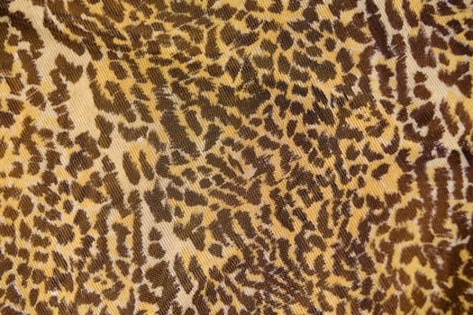 Part of the surface the nylon scarf with animal pattern. macro photography