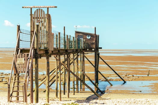 Hut of the fisherman resting on piles in Yves bay, France