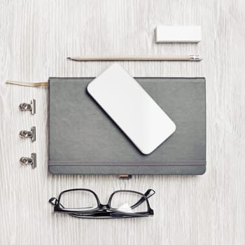 Blank corporate identity template on light wooden background. Photo of blank stationery set. Mockup for design presentations and portfolios. Top view. Flat lay.
