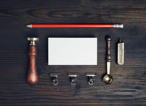 Blank retro stationery set on wooden background. Top view. Flat lay.