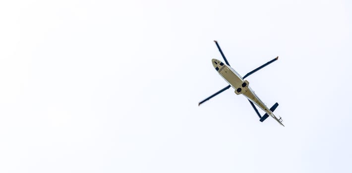 Helicopter in the sky, white clouds