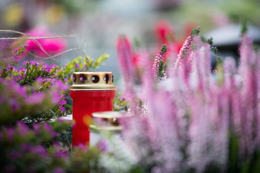 Candle on a grave at a cemetery