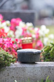 Holy water in iron bowl, cemetery
