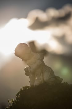 White angel on a grave at a cemetery