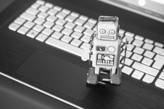 Symbol for a chat bot or social bot and algorithms, Laptop