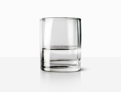 Glass with water on a light background.