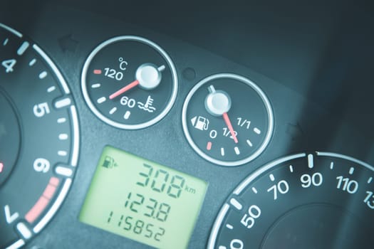 Close up picture of car dashboard with instruments and tachometer
