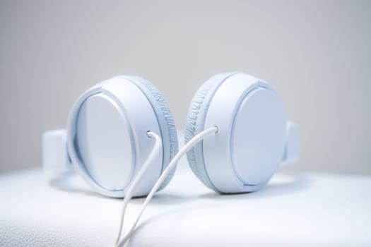 White designer headphones, music