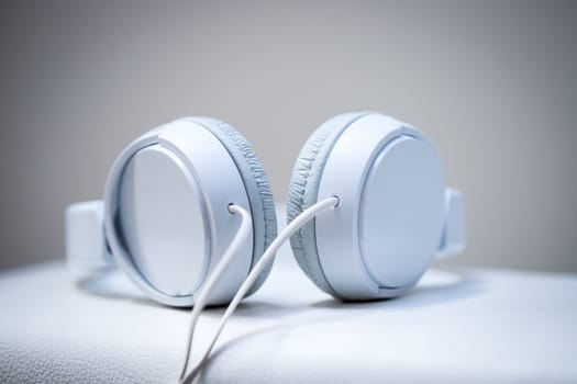 White designer headphones, music