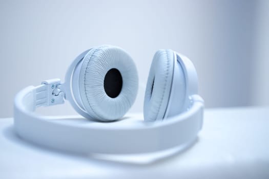 White designer headphones, music
