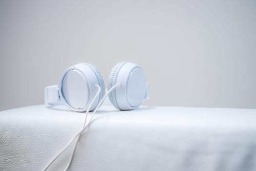 White designer headphones, music