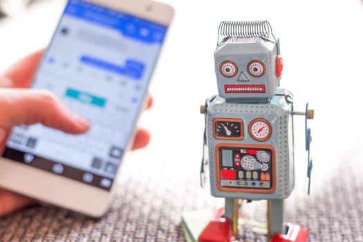 Symbol for chat bot, smartphone and messenger
