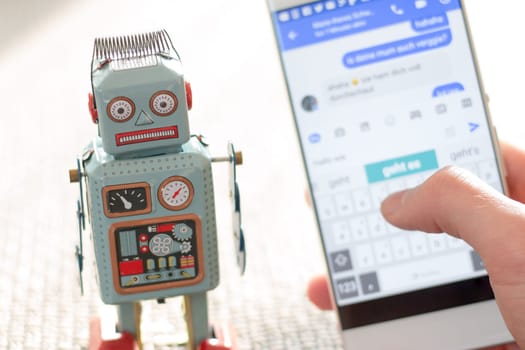 Symbol for chat bot, smartphone and messenger