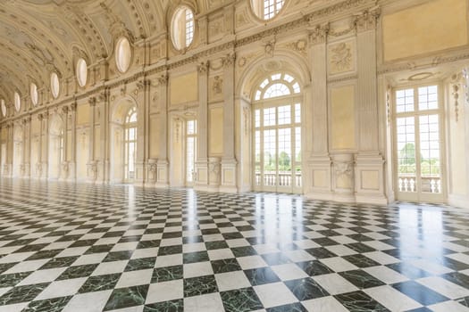 VENARIA REALE, ITALY - CIRCA MAY 2021: corridor with floor made of luxury marbles. Plenty of elegance for this Italian interior in Venaria Reale, Piedmont region.