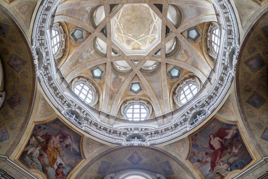 TURIN, ITALY - CIRCA MAY 2021: Antique baroque interior with vintage decoration. Royal Church of San Lorenzo (St. Lawrence).