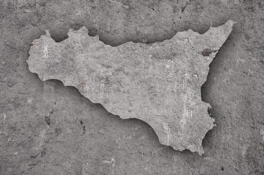 Map of Sicily on weathered concrete