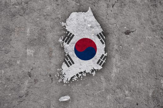 Map and flag of South Korea on weathered concrete