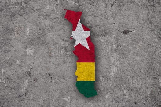Map and flag of Togo on weathered concrete