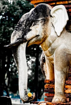Wat Sorasak chedi surrounded by elephants. CHEDI WAT CHANG LOM (Elephant Temple).Sukhothai Historical Park covers the ruins of Sukhothai. Stupa decorated with elephant reliefs in the temple ruins