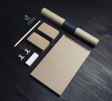 Blank vintage stationery set on wood table background. Responsive design mockup.