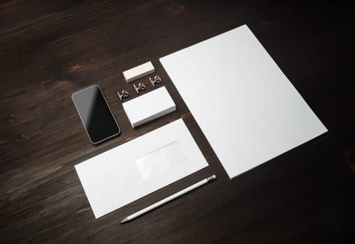 Blank corporate stationery set on wooden background. Corporate identity template. Responsive design mockup.