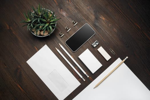 Blank corporate stationery for branding design. Corporate identity set on wooden background. Flat lay.