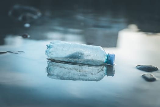 Environmental pollution: plastic bottle on the beach