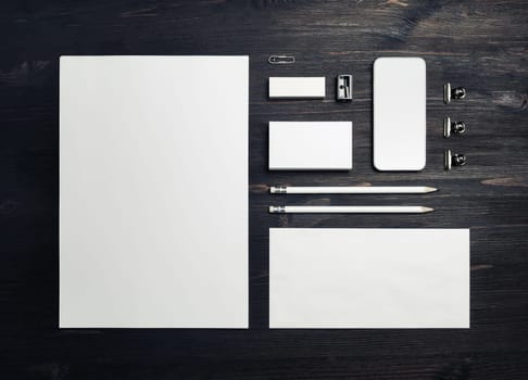 Blank business stationery set. Corporate identity template on wooden background. Flat lay.