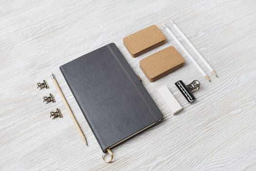 Corporate identity template. Branding mock up. Blank business stationery mock-up on light wood table background.
