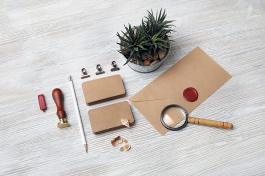 Blank retro stationery set on light wooden background. Corporate identity set. Template for branding identity.