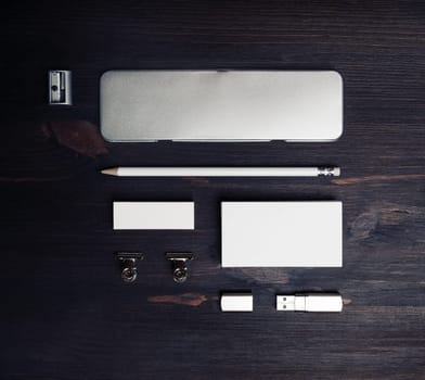 Blank corporate stationery set on wood table background. Template for branding identity. Flat lay.
