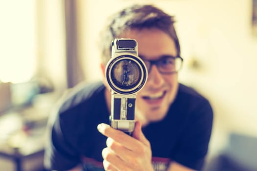 Filmmaker is doing a movie, vintage old movie camera