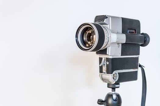 Vintage old movie camera, white background