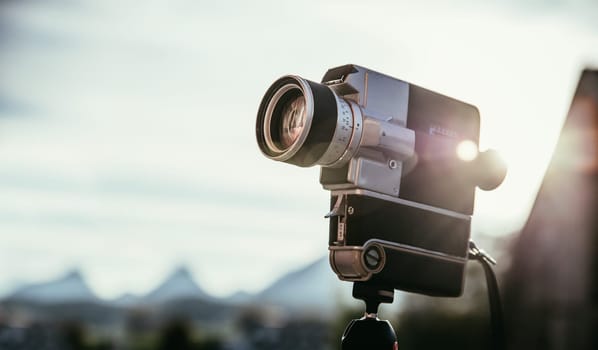 Vintage old movie camera, outdoor, sunset