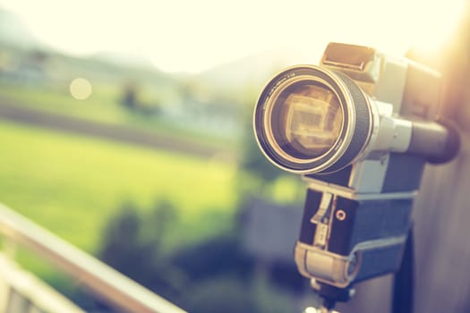 Vintage old movie camera, outdoor, sunset