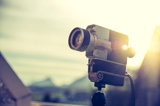 Vintage old movie camera, outdoor, sunset