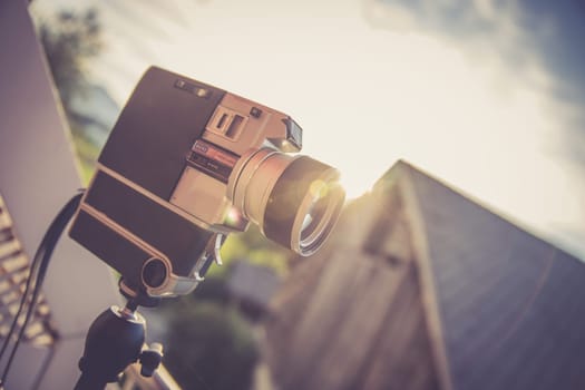 Vintage old movie camera, outdoor, sunset