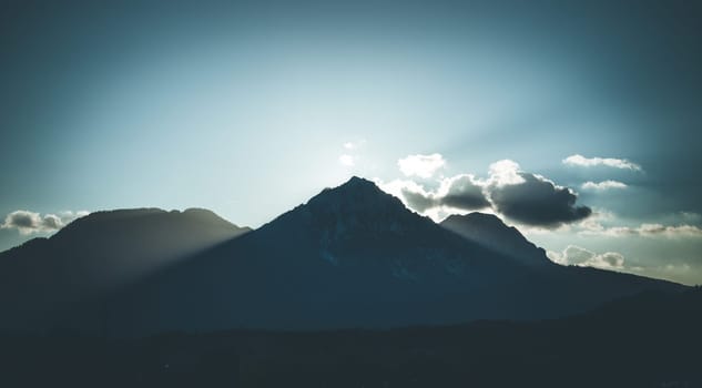 Sunset scenery on a mountain, cloudy sky