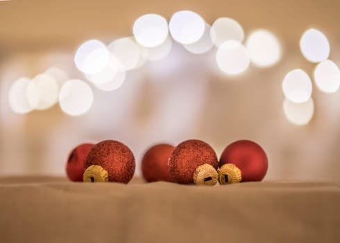 Red Christmas balls with decoration on shiny background