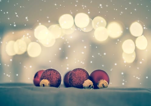 Red Christmas balls with decoration on shiny background