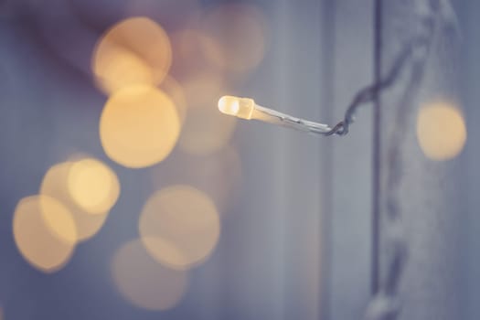 Closeup picture of christmas lightning and decoration, shiny background
