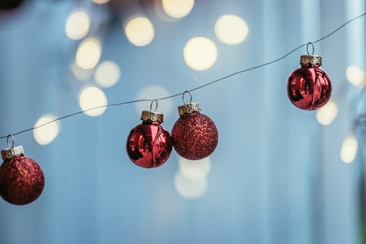 Red christmas baubles on a shiny blurry background
