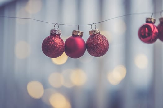 Red christmas baubles on a shiny blurry background