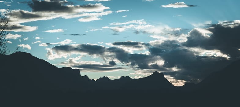 Beautiful mountain silhouette and blue sky, evening