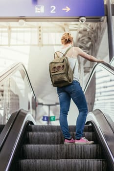 Young girl at the train station, travelling