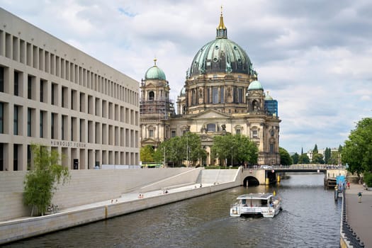 Spree River in Berlin with newly built Humboldt Forum (Stadtschloss) and historic Berlin Cathedral